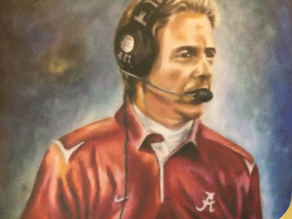 A picture of Nick Saban mouse pad.